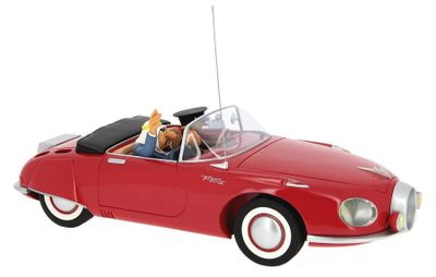 a red toy car with two dogs in it