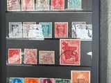 an open book with stamps on it sitting on a table