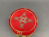 an image of a red box with a gold design on it