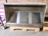 a metal box that is sitting on a pallet