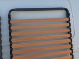 two wooden slats on the back of a white van