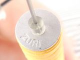 a close up of a person ' s hand holding a screwdriver