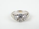 a close up of a ring with diamonds on a white background