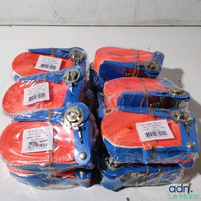 four pairs of red and blue luggage bags sitting on top of a white table
