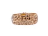 a close up of a gold ring on a white background
