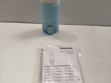 a blue cup and a receipt sitting on a table