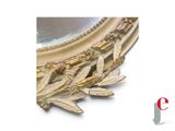 a picture of a gold leaf decoration on a mirror