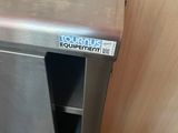 a stainless steel counter with a bowl on top of it