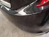a close up of a car ' s rear end with a sticker on it