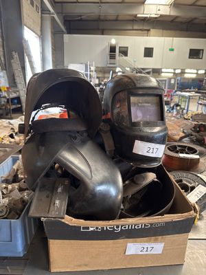 a box full of helmets and other items in a warehouse