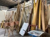 many pieces of wood that are sitting in a room
