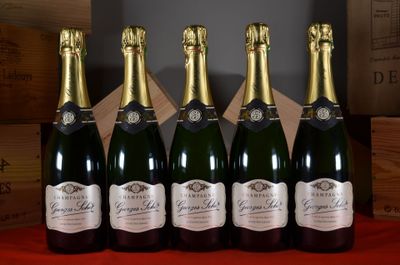 six bottles of champagne are lined up in a row on a table