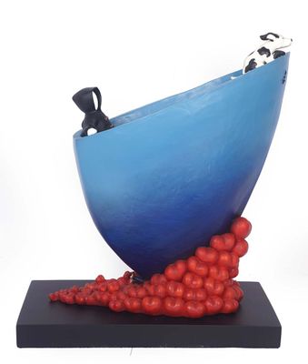 a sculpture of a blue bowl with red balls on it