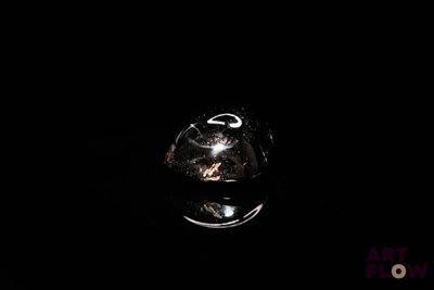 an image of a glass of wine in the dark