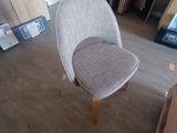 a chair that is sitting in the middle of a room