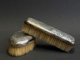two brushes that are sitting next to each other