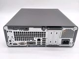 the back view of a computer with a hard drive attached to it