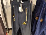 a rack with many different sports pants hanging on it