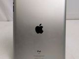 an apple ipad sitting on top of a table next to a white background