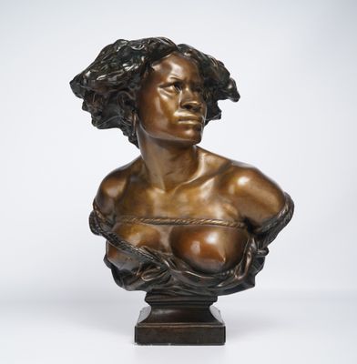 a bronze busturine of a woman with curly hair