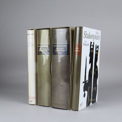 three books are stacked on top of each other on a table