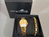 a watch and bracelet in a box on a table