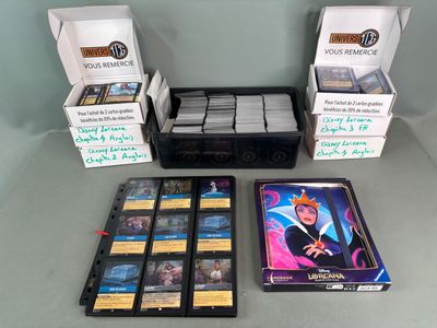 a lot of cards and a box of games on the table