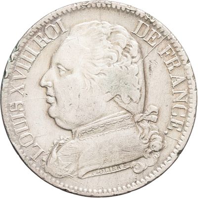 gros plan d'une pièce d'argent avec le visage d'un homme