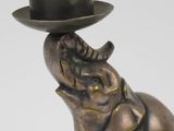 a statue of an elephant with a hat on its head