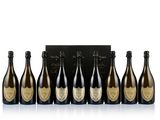 a group of six bottles of champagne sitting next to each other