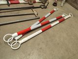 several pairs of scissors are laying on the floor next to some other tools