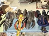 many pairs of shoes that are on display in a store