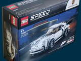 a box of lego speed racing cars on a blue background