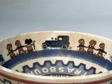 a bowl that has a picture of a train and people on it