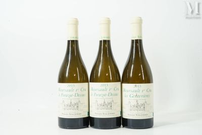 three bottles of wine sitting on top of a table next to each other