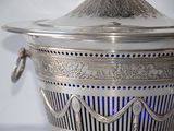 a silver container with a blue light inside of it