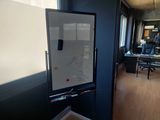 a white board on the wall in a room
