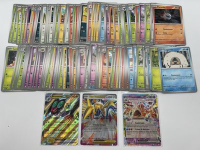 the pokemon cards are lined up on the table ready to be played