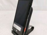 a cell phone that is sitting on top of a stand