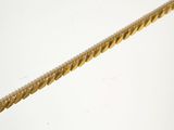 a close up of a gold rope on a white background