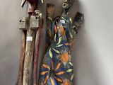 two figurines that are on the wall next to each other