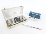 a box with a set of silverware and a knife in it