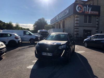 cars parked in a parking lot in front of a building