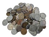 a pile of old coins on a white surface