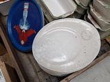 many plates and bowls sitting on a table in a room