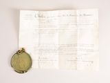 a close up of a piece of paper with a coin on it