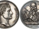 a close up of a silver coin with a man on it