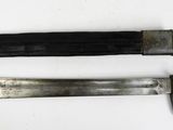 two different types of knives on a white surface