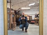 a man taking a picture of himself in a mirror