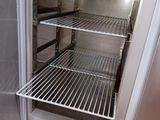 an open refrigerator that is sitting in a kitchen